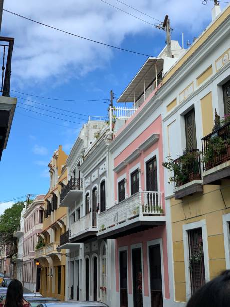 istock Row of colorful buildings under a partially cloudy sky 2156057854