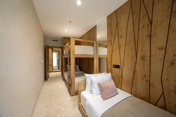 istock Interior of a hotel bedroom with bunk beds 2156059569
