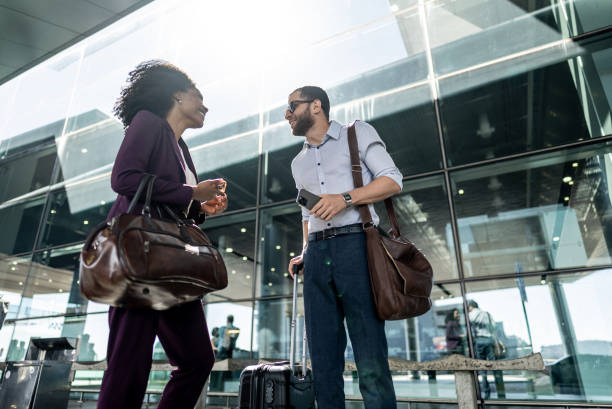 istock Coworkers talking at the airport 2156059720