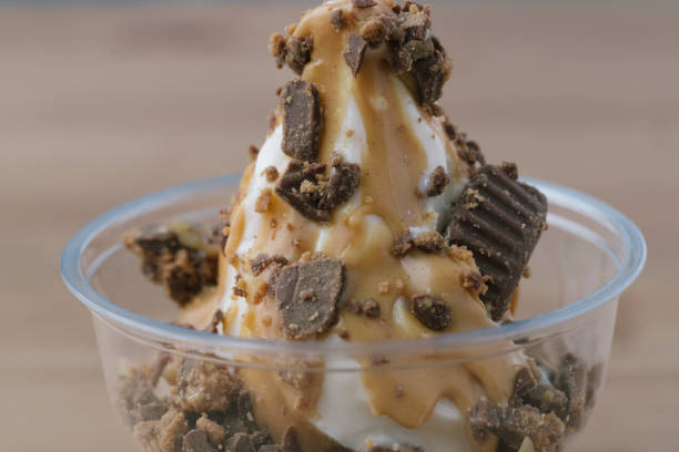 istock Plastic cup filled with delicious caramel ice cream 2156059739