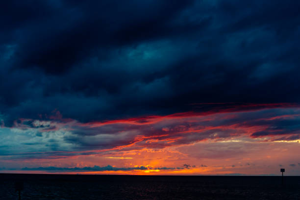 A sunset view of large cloudy skies