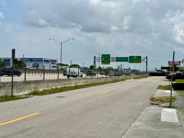 istock Highway with heavy traffic and overhead signs 2156060502