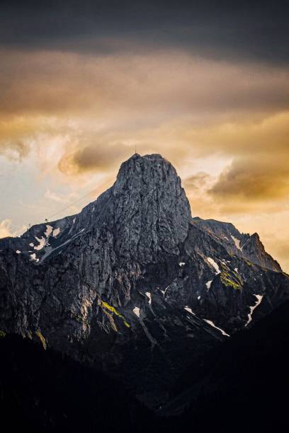 istock a very large mountain covered in snow at sunset or sunrise 2156060527