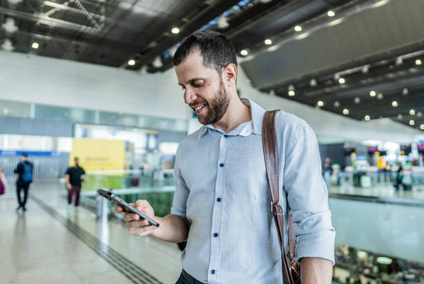 istock Businessman using the mobile phone at the airport 2156060840