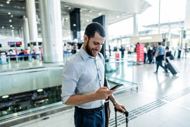 istock Businessman using the mobile phone at the airport 2156060893