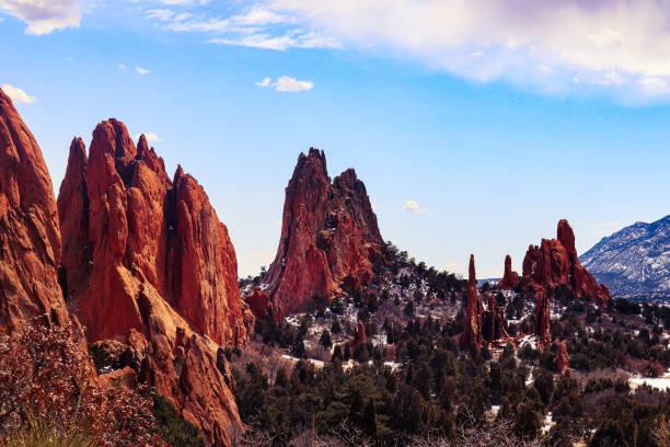istock Red rock pillars and mountains in the background 2156061107