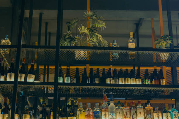 istock Various liquor bottles arranged on a bar counter 2156061936