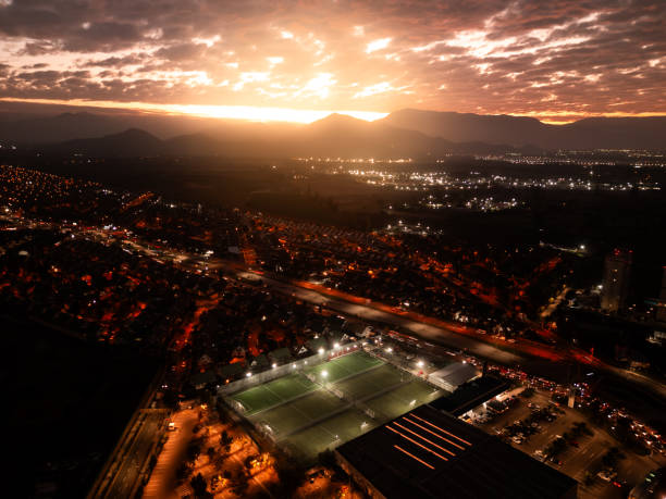istock Sunset over athletic field near massive mountain 2156062157