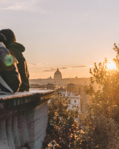 istock a couple of people looking at a skyline from a ledge 2156062607