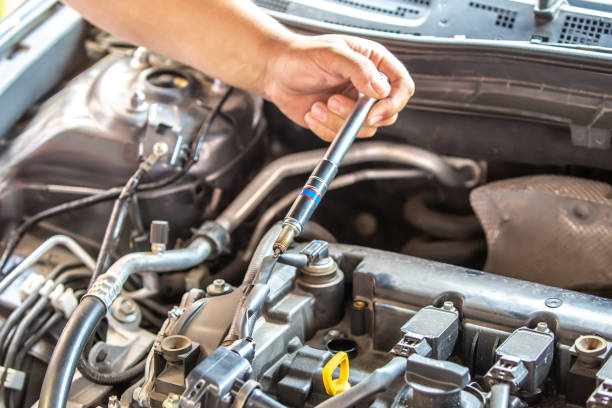 istock Combustion engine vehicle maintenance, replace of spark plugs 2156062899
