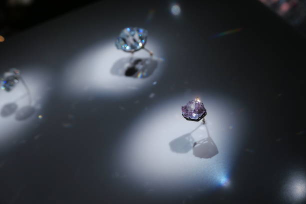 Diamonds on a gold nugget. 3d generated image. Depth of field.
