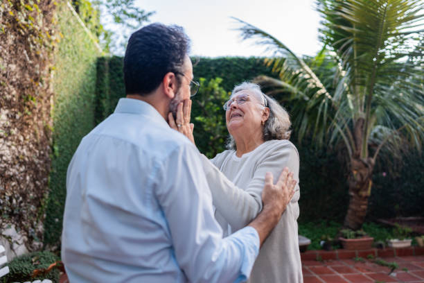 istock Senior woman greeting her son at nursing home 2156064621