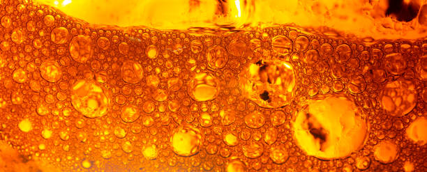 istock Yellow drink bubble texture close-up,Beer Background Ice Cold Pint With Water Drops Condensation,Golden yellow water drops. Nature collection. 2156064644
