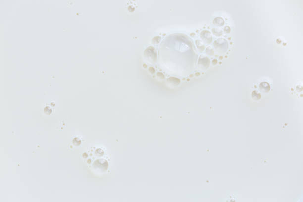 istock Macro milk surface close-up,Macro milk texture,White surface of milk and bubbles and ripples from above birds eye view 2156064655