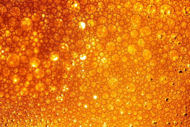 istock Yellow drink bubble texture close-up,Beer Background Ice Cold Pint With Water Drops Condensation,Golden yellow water drops. Nature collection. 2156064768