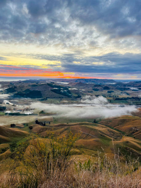 istock Sunrise over valley viewed from hilltop above clouds 2156065000