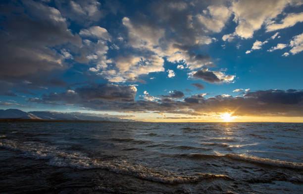 istock Sun shining brightly over water in a clear sky 2156065371
