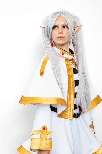 istock Female cosplayer dressed as an elf character with white hair on a white background 2156066086