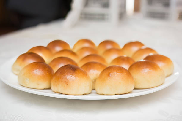 Close-up of bread rolls on a white plate