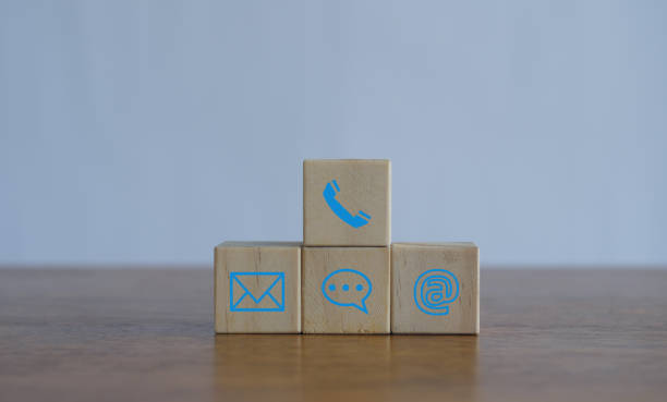 istock Customer support hotline Contact us people connection.Website page contact us or e-mail marketing concept,  Chat message icons. address,call phone, address, Label wood with the email. 2156071312