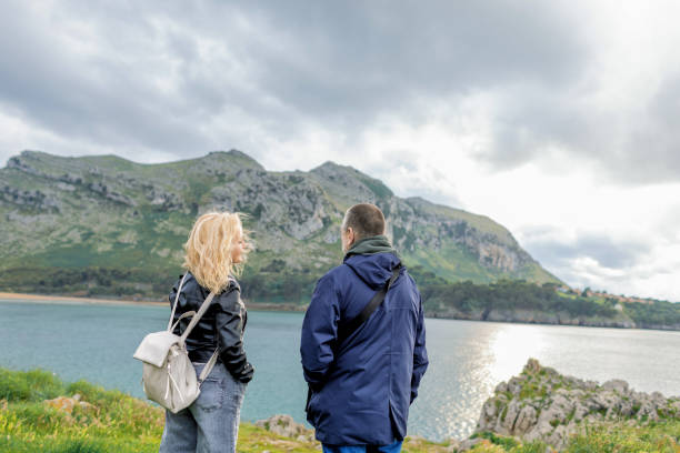 istock Couple walking in seaside 2156071656