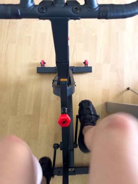 istock Man doing exercise bike. Gym at home. 2156071803