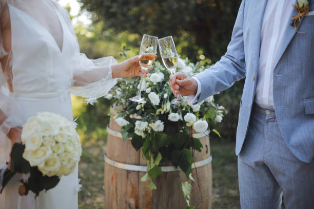 istock Bride And Groom Toasting Champagne Flutes 2156072777