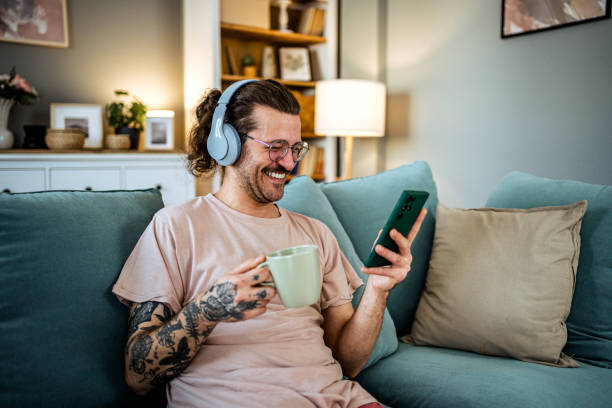 istock Young man enjoying free time at home 2156073587