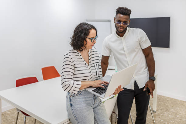 istock Woman and Man Working on Laptop in Office 2156073681