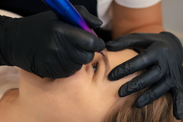 istock procedure of permanent makeup in tattoo salon 2156074233