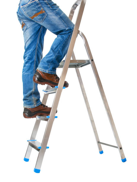 istock Handyman climbing on a ladder isolated on  white background 2156074376