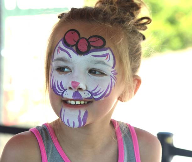 istock Five-Year-Old Girl Posing with Kitten Face Paint 2156076829