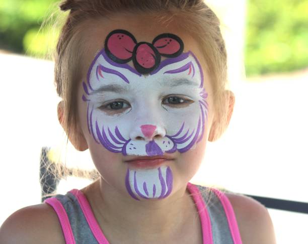 istock Five-Year-Old Girl Looking Happy After Face Paint Application 2156076842