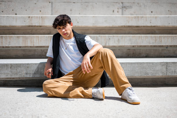 istock Young man posing by the cincrete straircase 2156079935