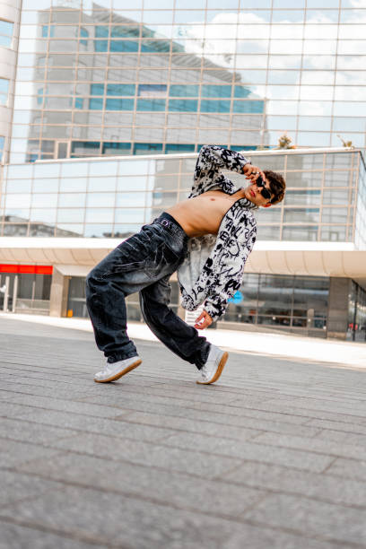 istock Young male dancer posing outdoors 2156080672