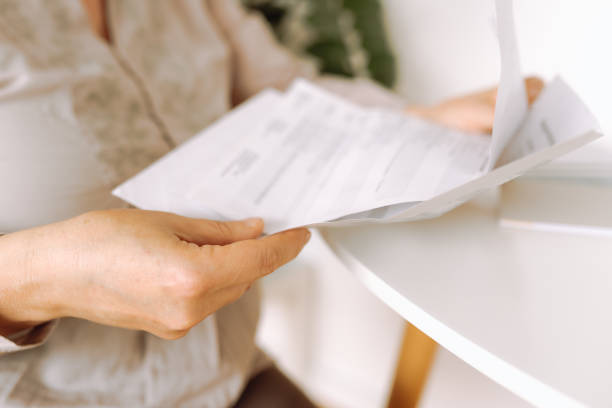 istock woman's hands holding an envelope with a letter 2156084381