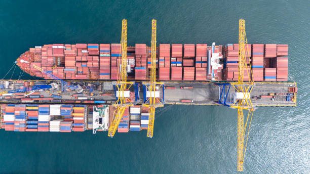 istock Aerial top view of container ship in a container terminal port. 2156087782