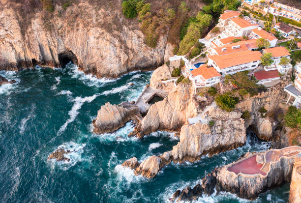 La Quebrada is a 45-metre high cliff, with a channel seven metres wide and four metres deep, located in the port of Acapulco, Guerrero, in southern Mexico, which was created by dynamiting a hill.1 Since 1934, the famous dives have been performed there by young people from the port who sometimes climb it with a lit torch.