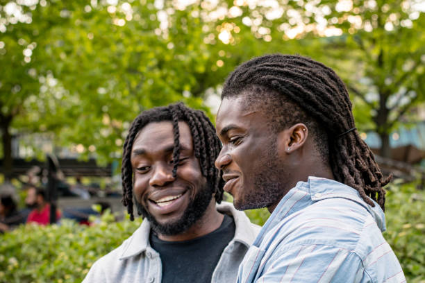 istock Lively Chat: Young Black Men Seated Amidst Downtown Winnipeg's Bustle 2156090865