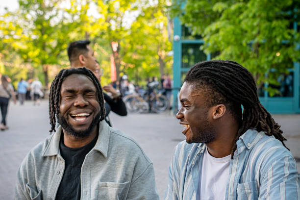 istock Lively Downtown Gathering: Young Black Men Chat in Bustling Downtown Winnipeg 2156090876