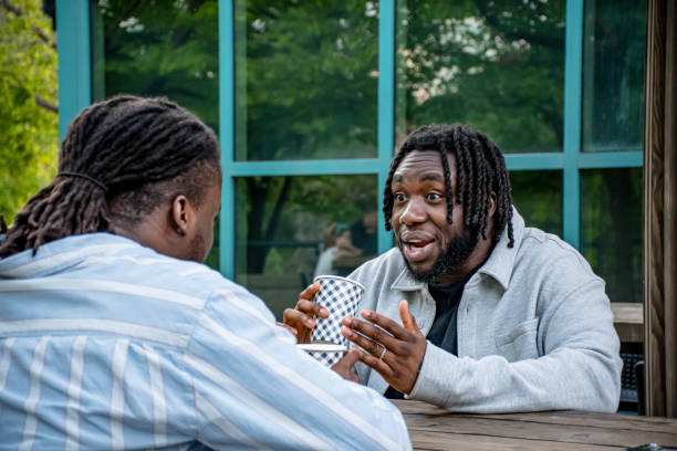 istock Downtown Dialogue: Young Black Men Chatting in Winnipeg 2156090944