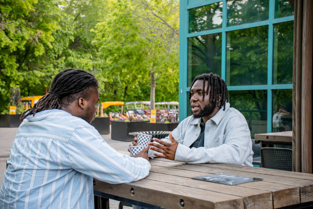 istock Downtown Dialogue: Young Black Men Chatting in Winnipeg 2156090948