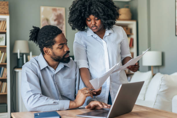 istock Couple doing their budget at home 2156091500