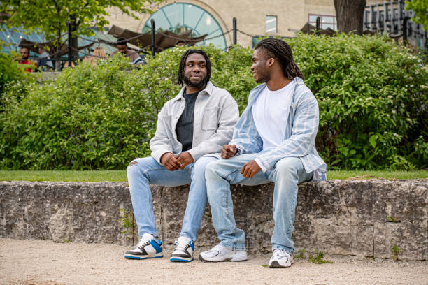istock Downtown Dialogue: Young Black Men Chatting in Winnipeg 2156092427
