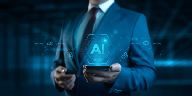 istock AI - artificial intelligence and machine learning. Businessman hold smartphone with icons 2156094732