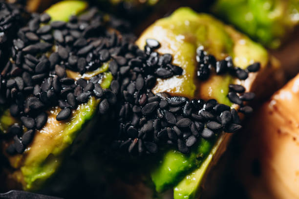 Delicious green dragon roll with rice, cream cheese, eel, cucumbers, avocado, unagi sauce, sesame