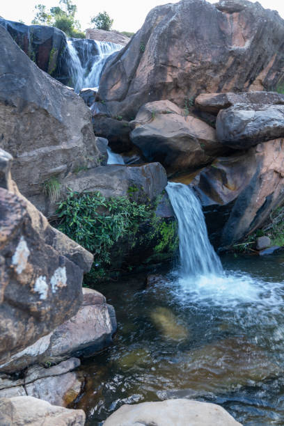 istock Small waterfall over boulders, Ambositra, Madagascar 2156100434