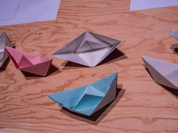 istock table paper origami on the wooden table 2156100550