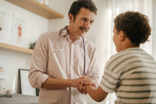 istock Man therapist with little boy 2156101567