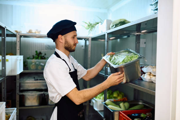 istock Chef taking fresh groceries from the pantry room. 2156105416